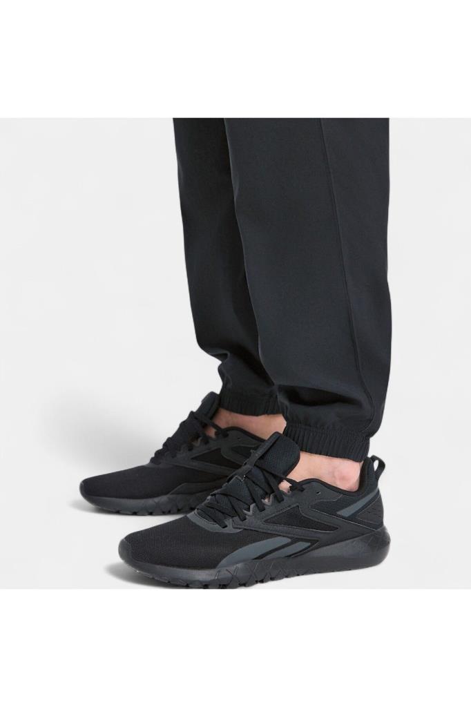 reebok-id-train-woven-pant-100215549-erkek-esofman-alti-siyah-s-xxl-29484.jpg